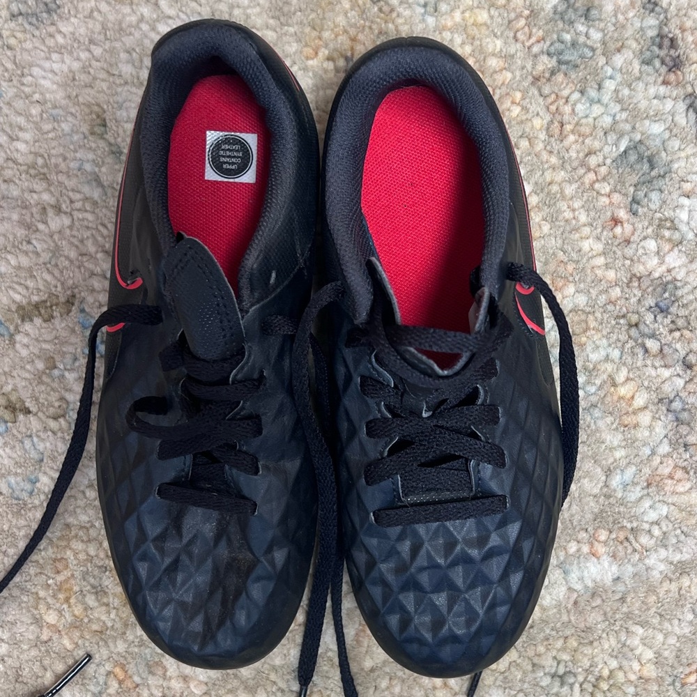 Kid's Nike Black Cleats with Red Detail